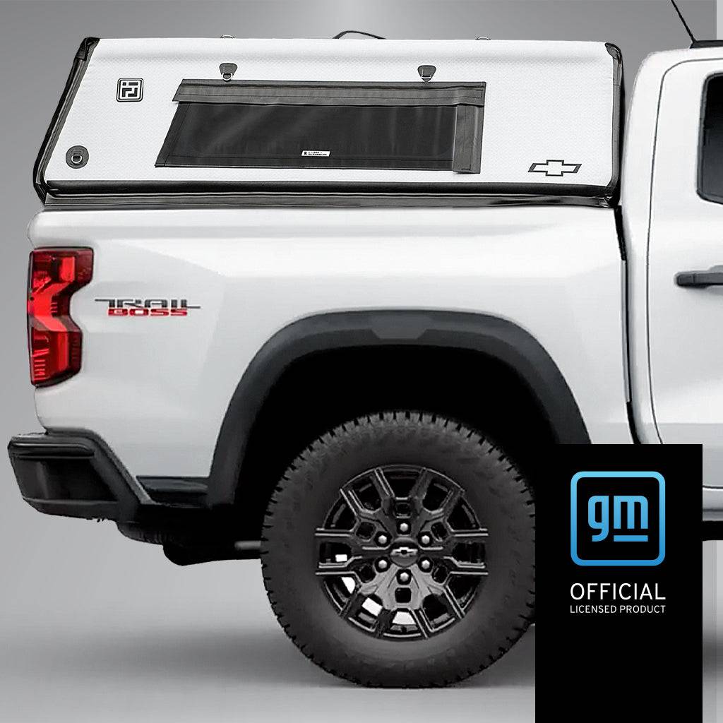 Flated Mid-Short CAP50 Colorado Inflatable Air Topper truck cap in white, mounted on a Chevrolet Colorado
